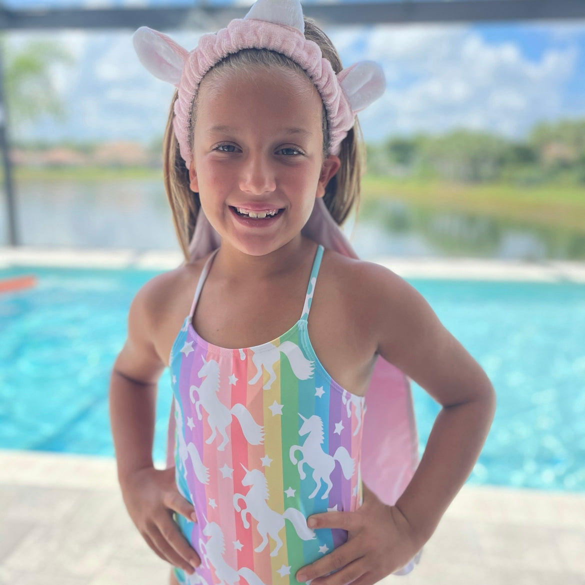 Magical Unicorn Towel Back.  A hair towel designed to allow hair to air dry and keep your back or shirt dry. Perfect for after a bath or shower or after swimming. This Towel Back has unicorn horn, ears and tail making it even more fun for kids to wear.