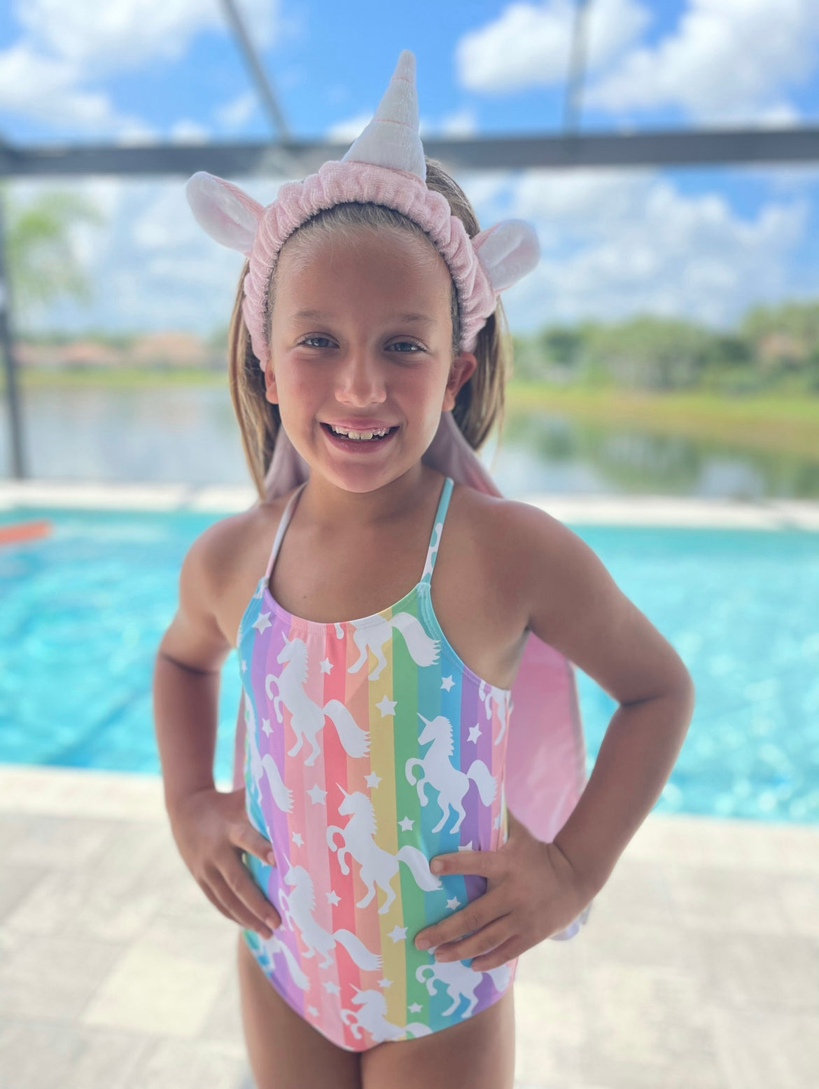 Magical Unicorn Towel Back.  A hair towel designed to allow hair to air dry and keep your back or shirt dry. Perfect for after a bath or shower or after swimming. This Towel Back has unicorn horn, ears and tail making it even more fun for kids to wear.